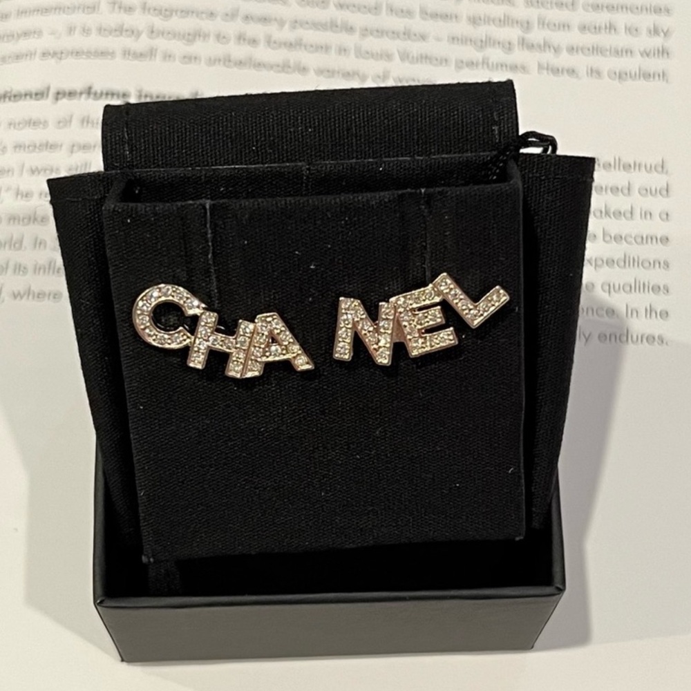 Authentic Chanel earrings. New. Full set with box, ribbon, camellia etc .